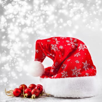 Christmas balls and ornaments in front of glittering background