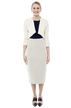 Full length image of smiling girl in trendy dress