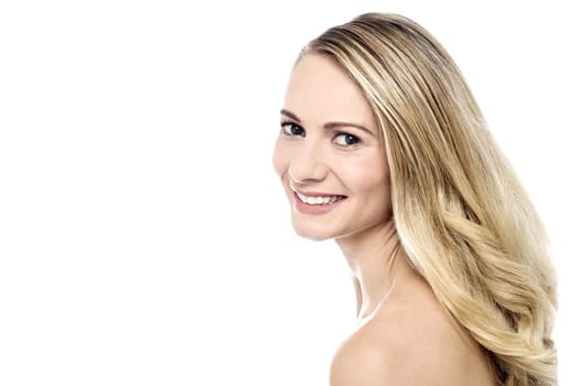 Young happy woman posing sideways over white