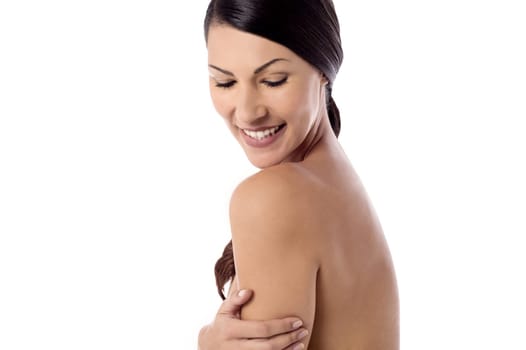 Topless pretty woman posing over white background