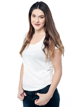 Pretty young woman posing stylishly over white