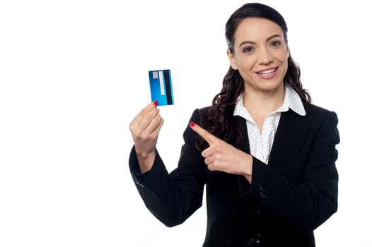 Female corporate executive displaying her credit card