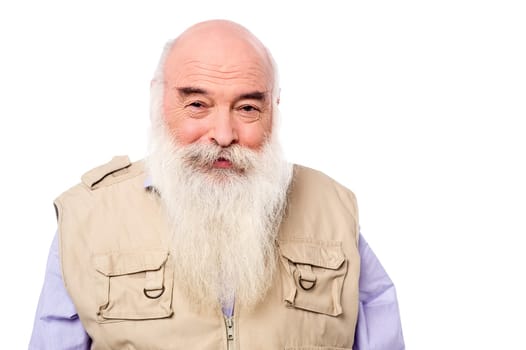 An old man posing casually to camera over white