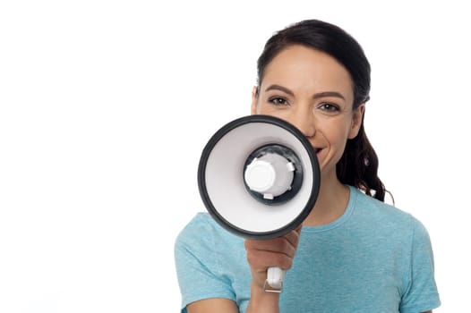 Image of a attractive woman advertising over megaphone