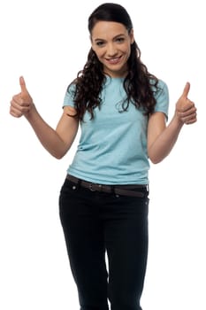 Portrait of a smiling woman with thumbs up gesture