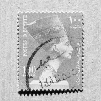 CAIRO, EGYPT - NOVEMBER 21, 2015: A stamp printed by Egypt shows the Queen Nefertiti wife of Egyptian Pharaoh Akhenaten in black and white