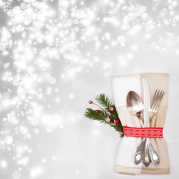 Table place setting on sparkling background