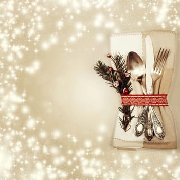 Table place setting on sparkling background
