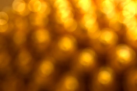 Abstract circular natural gold light bokeh background