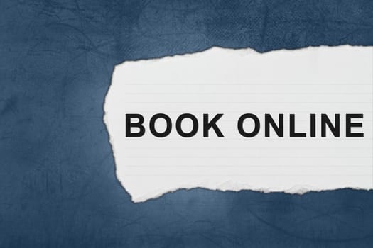 book online with white paper tears on blue texture