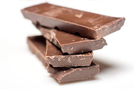 Parts of dark chocolate on the table