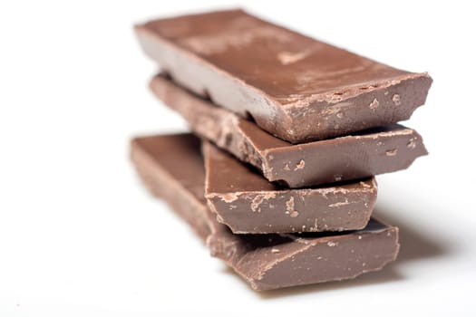 Parts of dark chocolate on the table