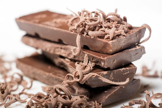 Parts of dark chocolate on the table