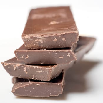 Parts of dark chocolate on the table