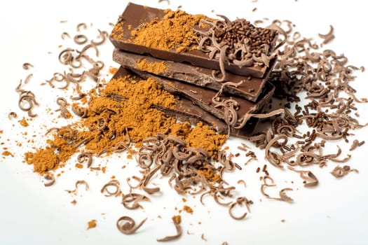 Parts of dark chocolate on the table