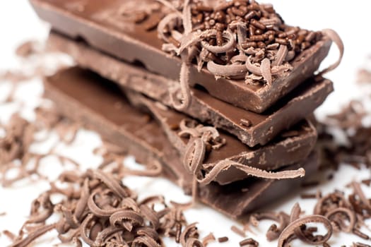Parts of dark chocolate on the table