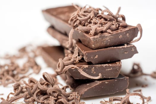 Parts of dark chocolate on the table