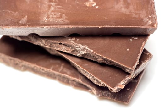 Parts of dark chocolate on the table