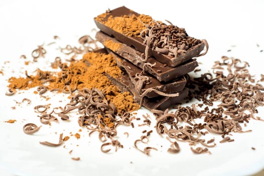 Parts of dark chocolate on the table