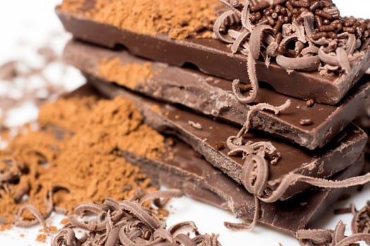 Parts of dark chocolate on the table