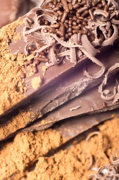 Parts of dark chocolate on the table