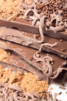 Parts of dark chocolate on the table