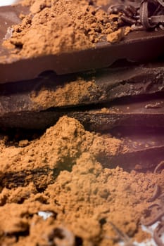 Parts of dark chocolate on the table