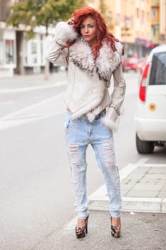 Beautiful Redhair Woman, Fashion Model In Artificial Fur Coat, Outdoor On Street Walking