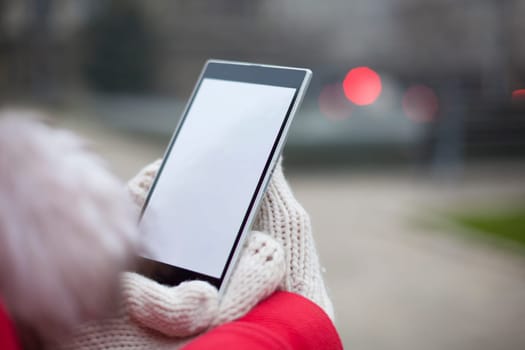 Traveling woman with mobile phone, cold weather