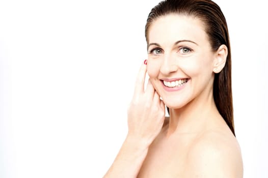 Woman posing with bare shoulders and natural look over white
