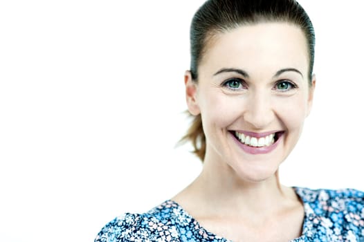 Close up shot of a woman smiling brightly