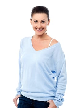 Happy woman posing with hands in pockets