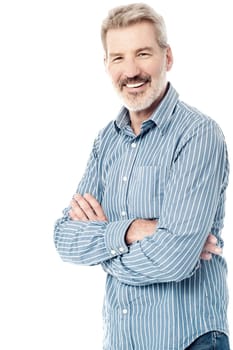 Senior man posing with crossed arms over white