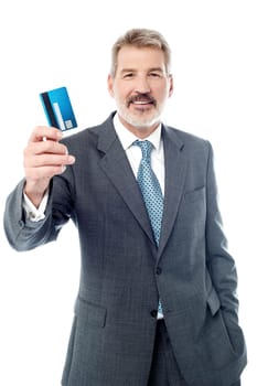 Elderly male showing credit card over white
