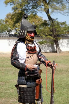KAGAWA, JAPAN - OCTOBER 25: Ancient firelock rifle fighters at Marugame Historical battle Festival, event dedicated to Japanese culture and tradition at Marugame-castle on October 25, 2015 in Japan.