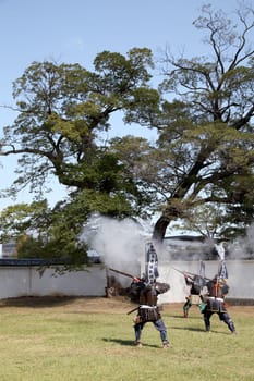KAGAWA, JAPAN - OCTOBER 25: Ancient firelock rifle fighters at Marugame Historical battle Festival, event dedicated to Japanese culture and tradition at Marugame-castle on October 25, 2015 in Japan.