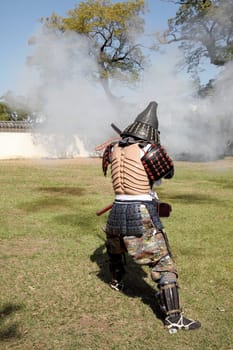 KAGAWA, JAPAN - OCTOBER 25: Ancient firelock rifle fighters at Marugame Historical battle Festival, event dedicated to Japanese culture and tradition at Marugame-castle on October 25, 2015 in Japan.