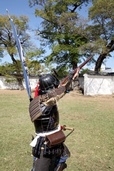 KAGAWA, JAPAN - OCTOBER 25: Ancient firelock rifle fighters at Marugame Historical battle Festival, event dedicated to Japanese culture and tradition at Marugame-castle on October 25, 2015 in Japan.