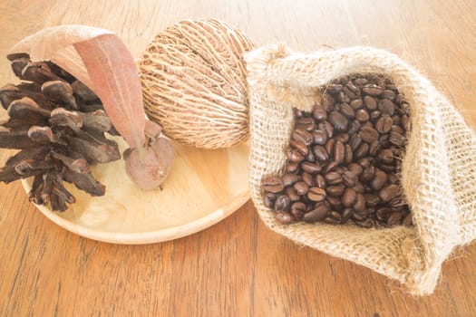 Coffee roasted bean on wooden table vintage style, stock photo