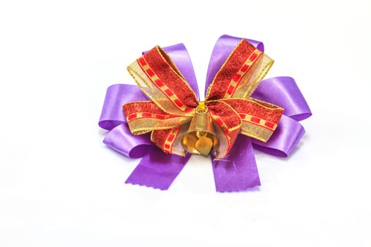 bell and ribbon with bow isolated on white