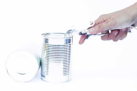 Close-up tin can with hand isolated on white background, stock photo