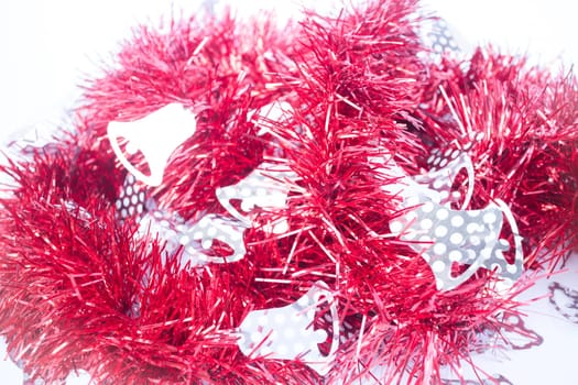 Red holiday decoration ribbon on white background, stock photo