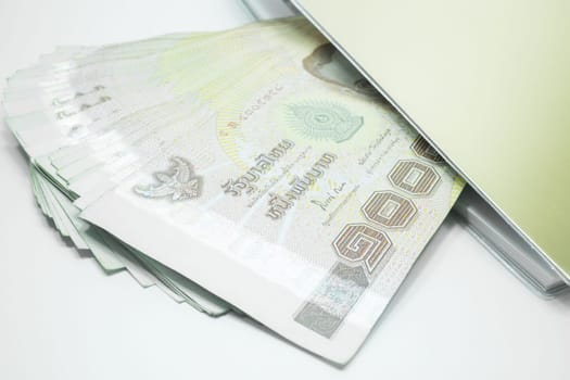 Thailand banknotes arranged in set and note book