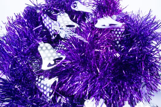 Purple holiday decoration ribbon on white background, stock photo