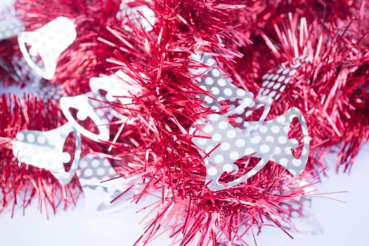 Red holiday decoration ribbon on white background, stock photo