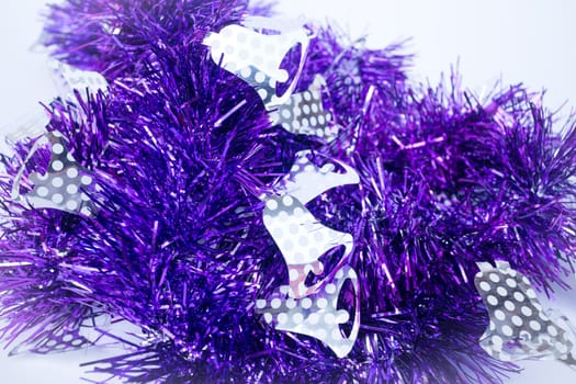 Purple holiday decoration ribbon on white background, stock photo