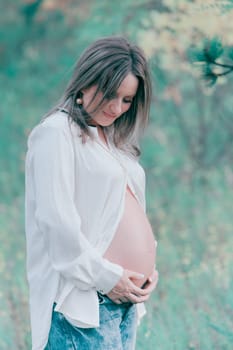 Portrait of a beautiful pregnant woman outdoor.