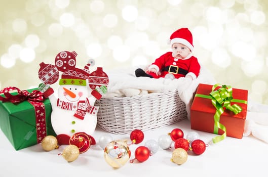 5 months old baby dressed as Santa for Christmas.