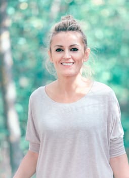 Beautiful woman portrait enjoying a fall day in the woods.