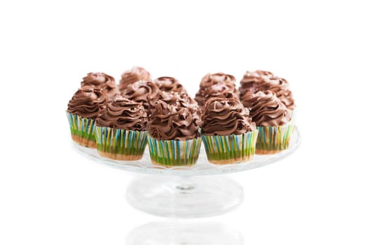 Chocolate cupcakes, homemade, over white background.
